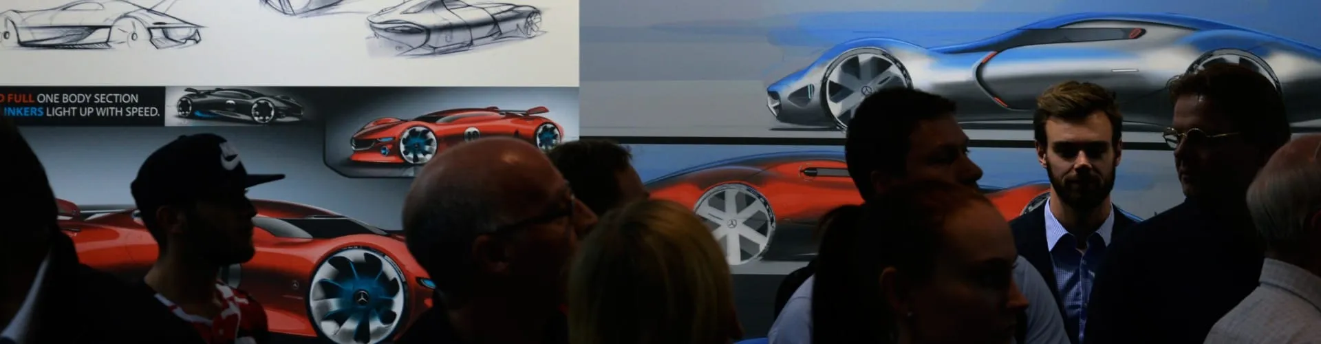 Grayscale automotive design sketches of a futuristic GT concept car shown from multiple perspectives