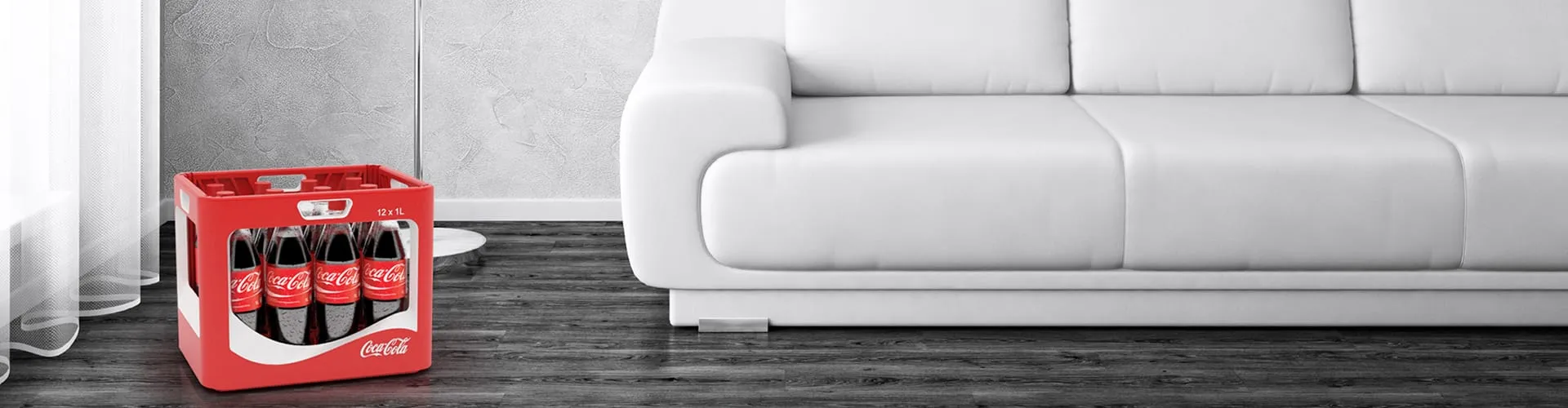 WAVE Coca-Cola multi-cycle crate standing on a dark floor in front of a white sofa, wide shot