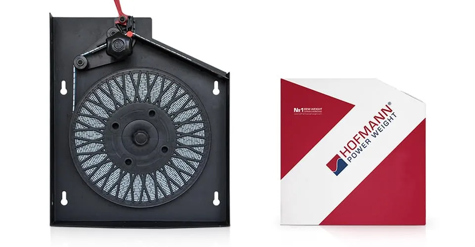 Old mechanical metal dispenser beside new Hofmann Power Weight SPEEDBOX cardboard unit