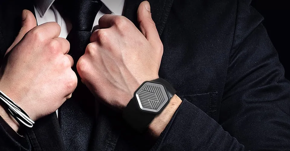Man in suit wearing Covestro 3D-printed Watch wearable with hexagonal patterned display on wrist