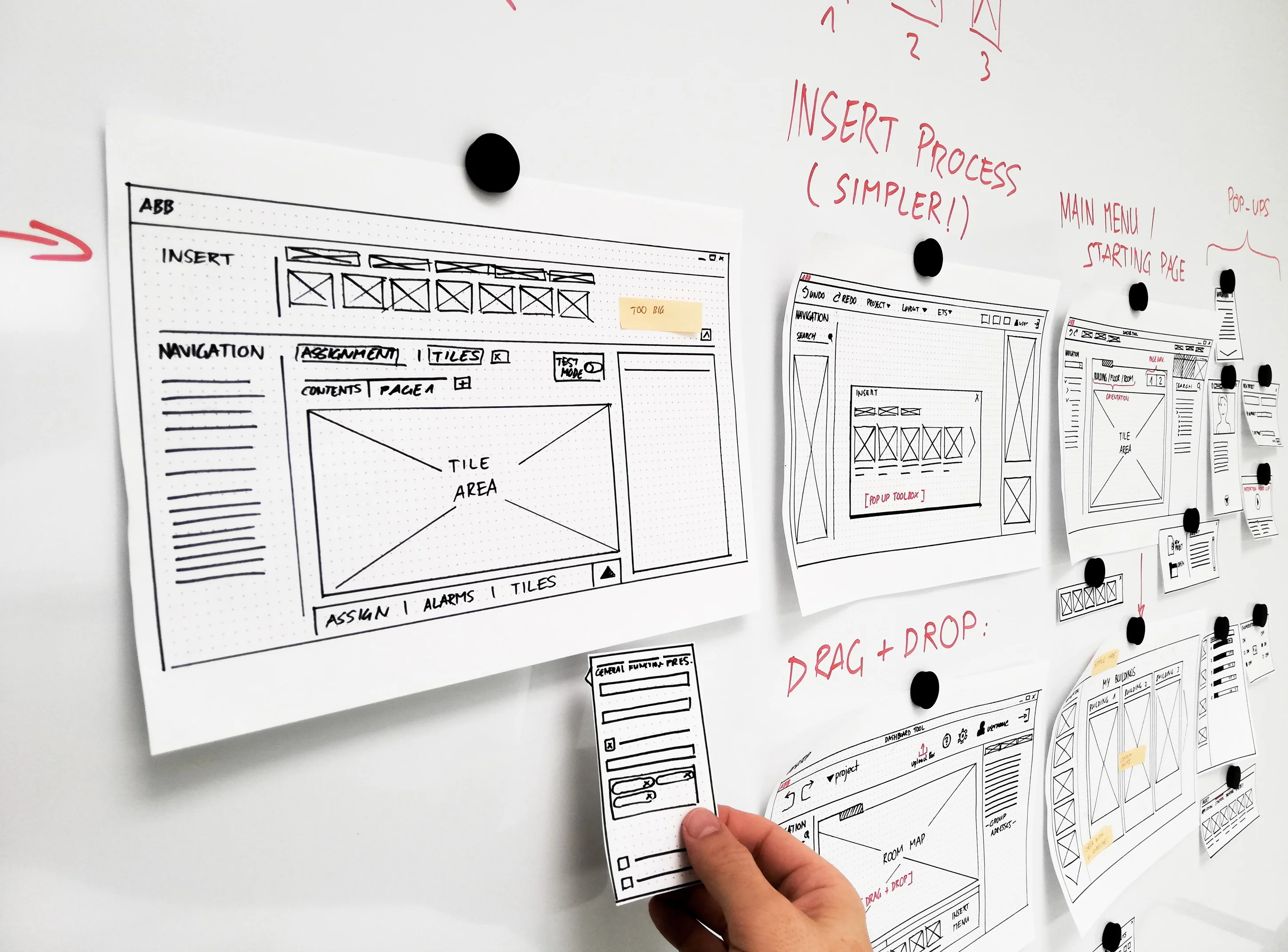 UX wireframes and interface sketches on whiteboard